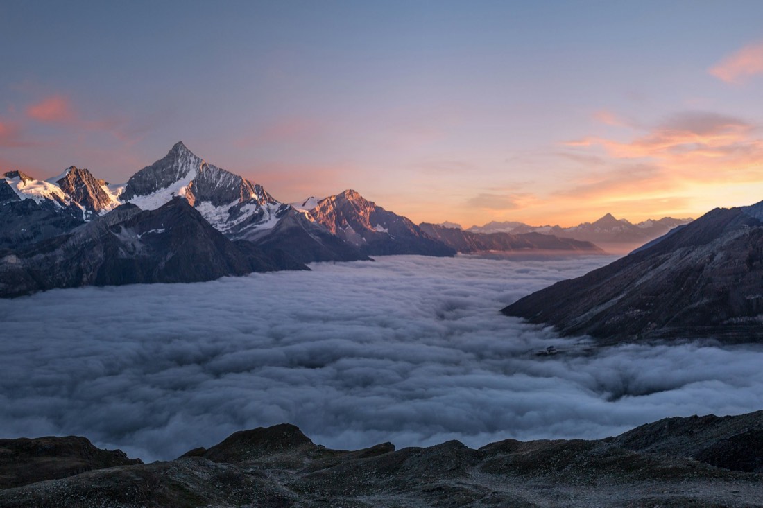 Mountain ridgelines above cloud